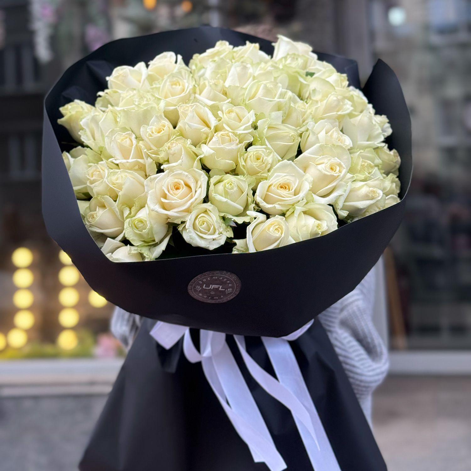 Bouquet 51 white roses in black wrapping