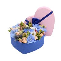 delphinium, oasis, spray rose (2 pcs.), eryngium, freesia (3 pcs.), eustoma (2 pcs.), heart-shaped box, packaging, ribbon