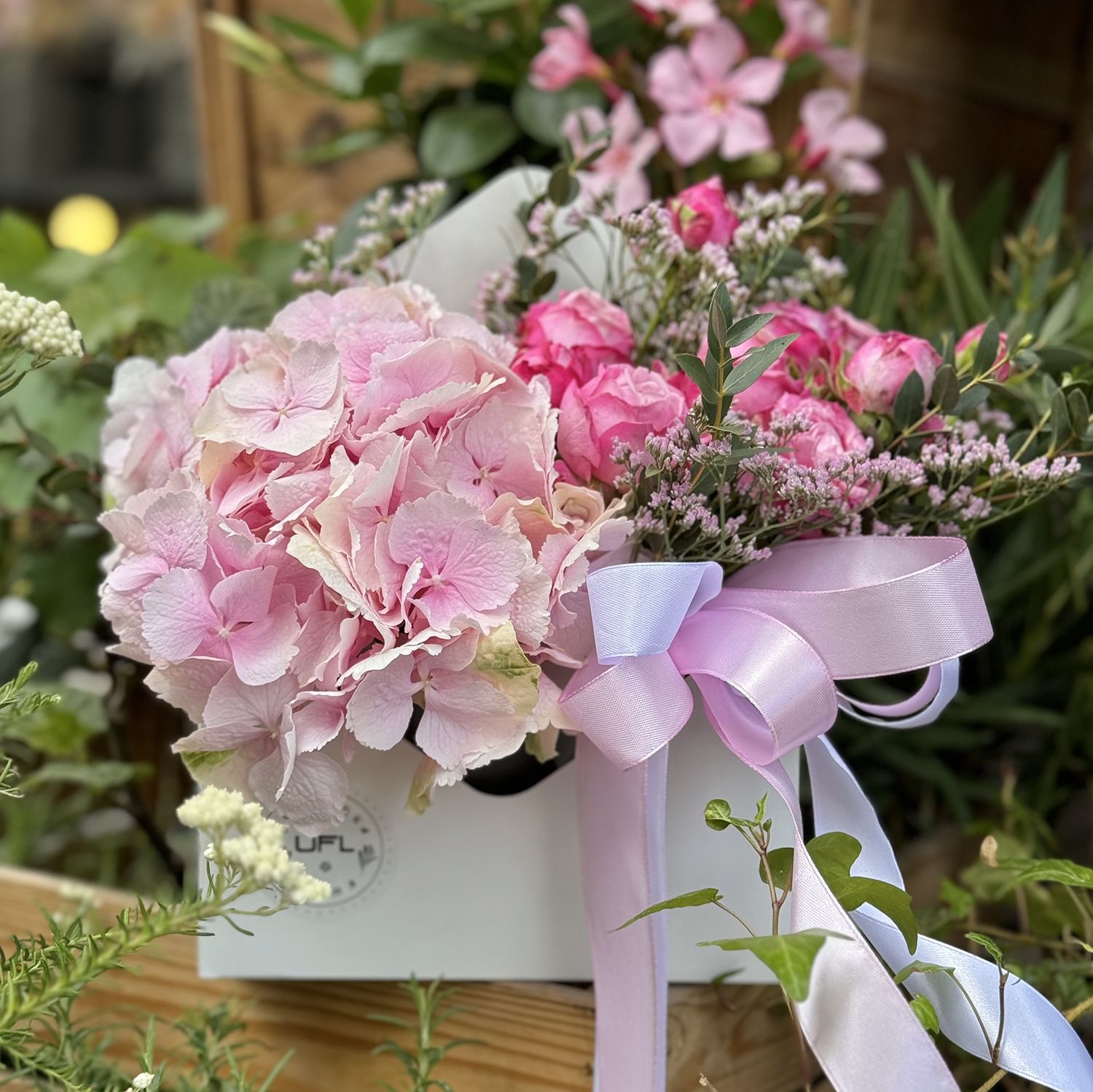 pink hydrangea, spray rose (2 pcs.), limonium, oasis, floral envelope, packaging, ribbon