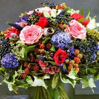 Original floristry: bouquet with berries and fruits